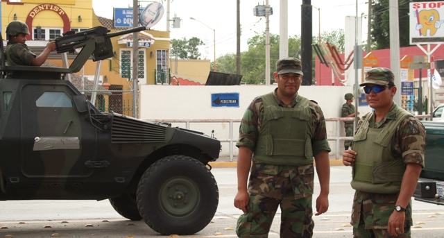 Armed guard at the Mexican-Texas border crossing